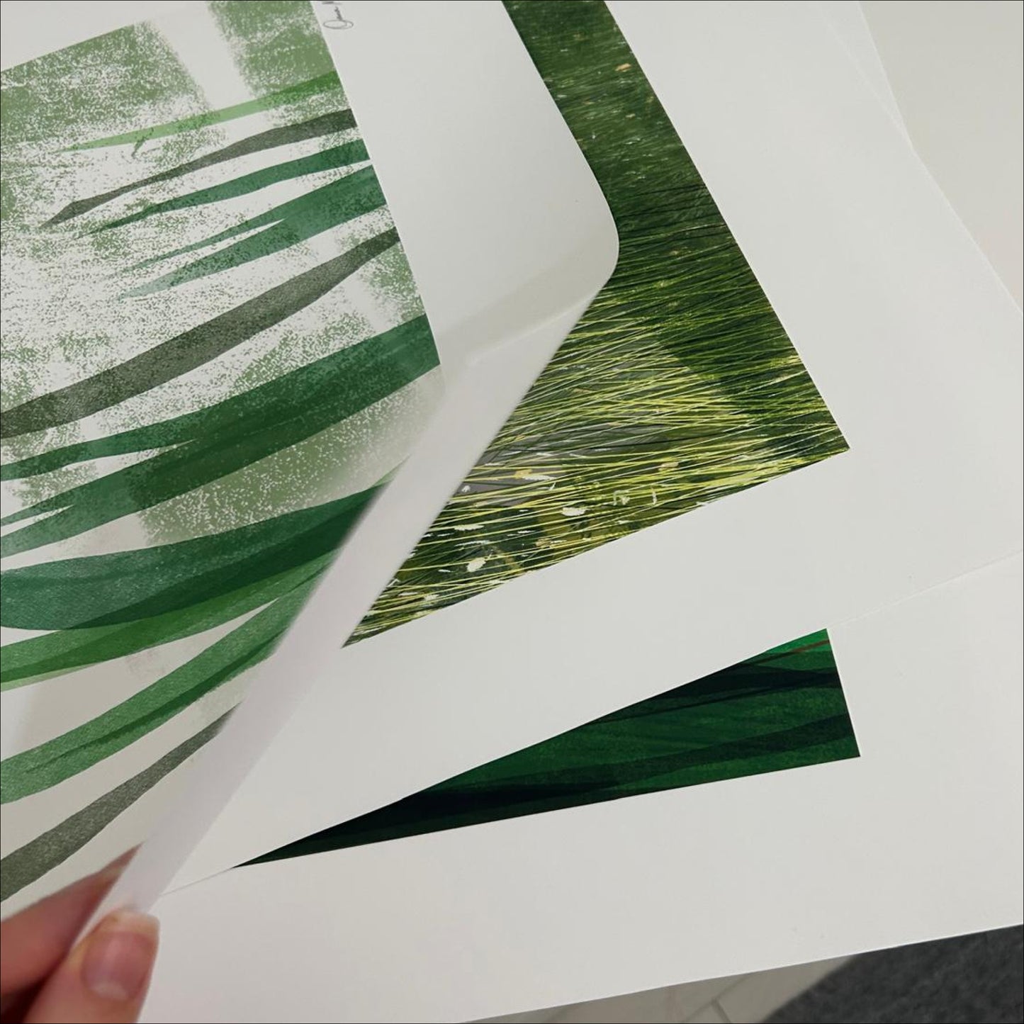Print detail of Held by the Field by OAM Studio — layered green grass texture on premium matte paper