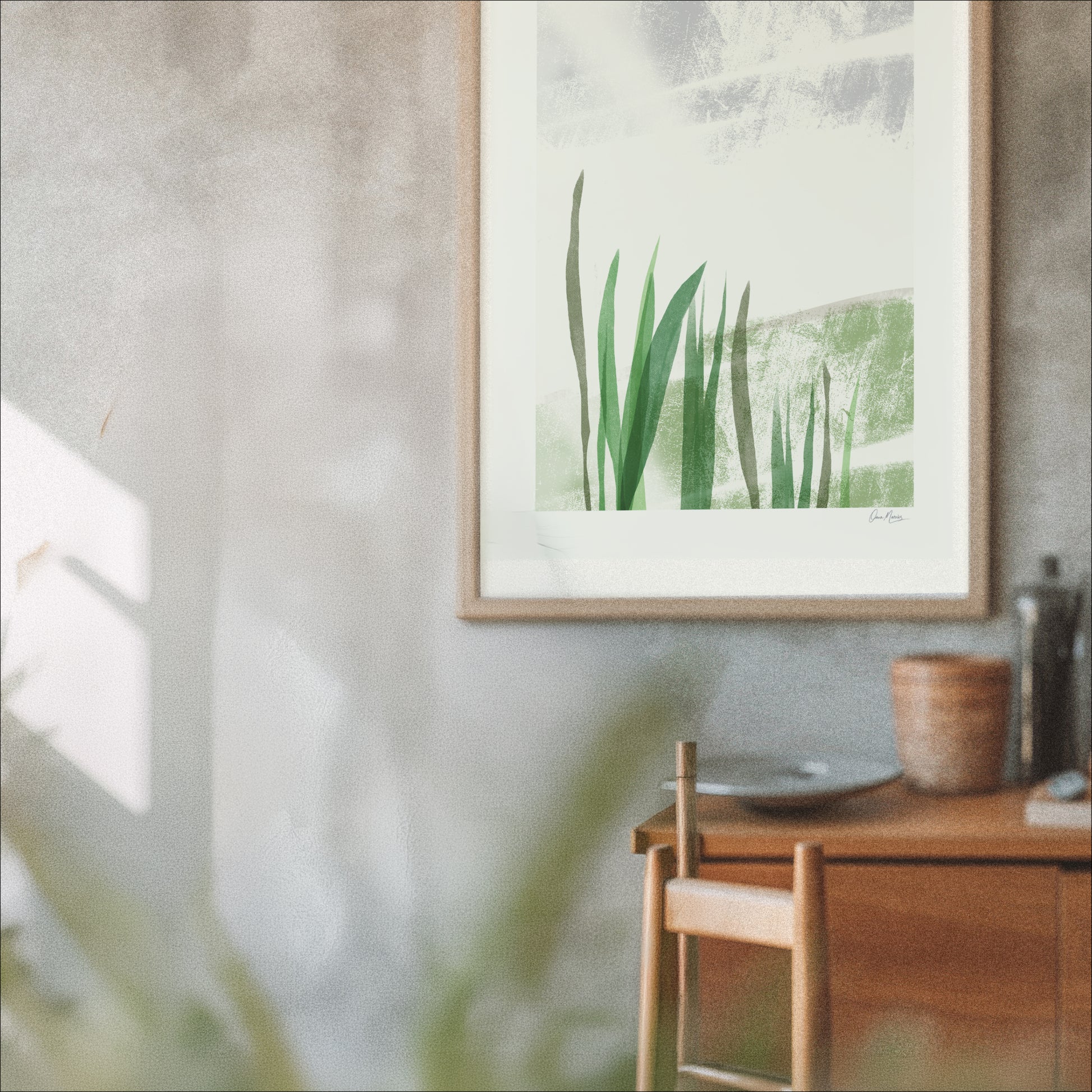 Held by the Field art print framed on a grey wall above a wooden sideboard, OAM Studio