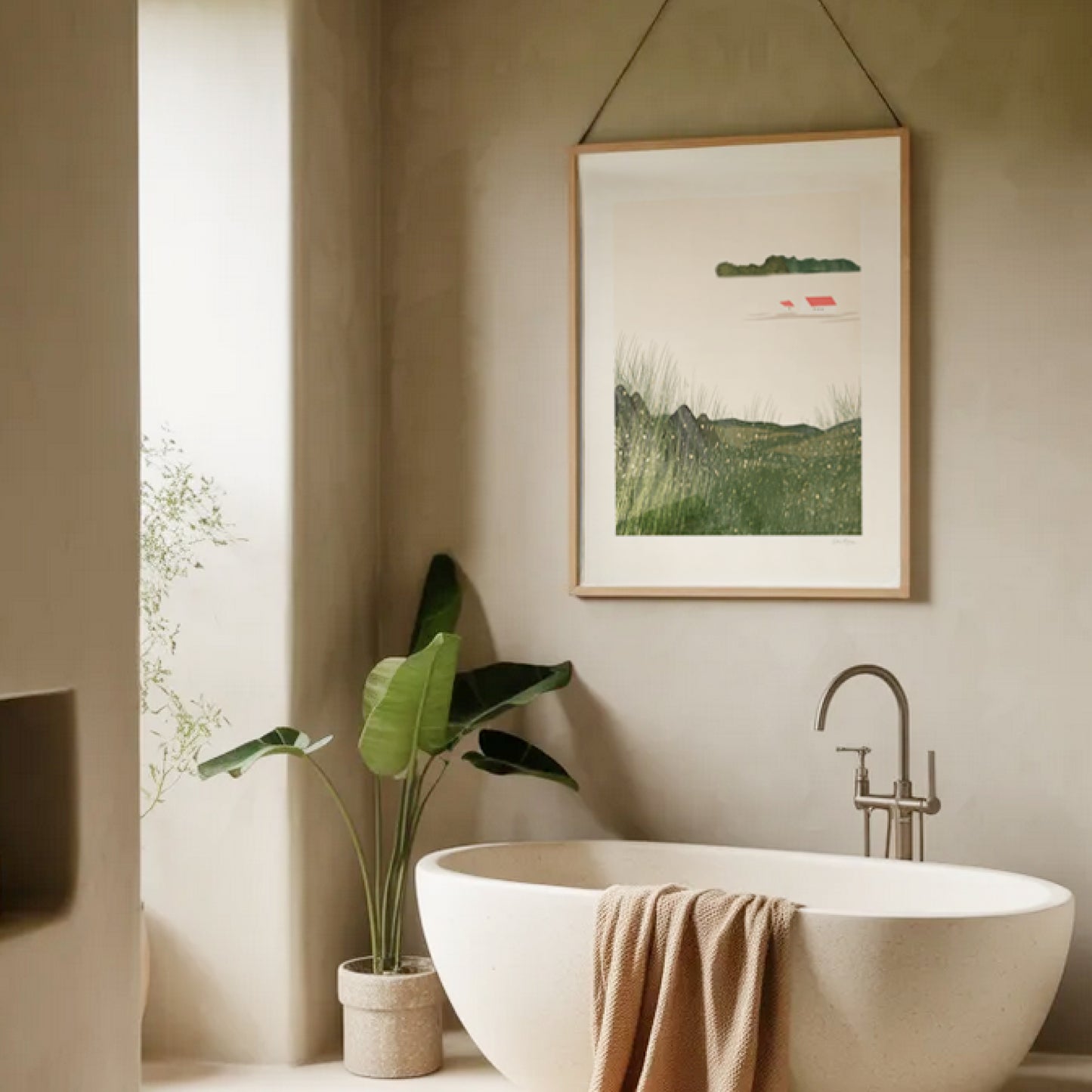 Quiet Meadow art print hanging in a minimalist bathroom above a freestanding bathtub, OAM Studio