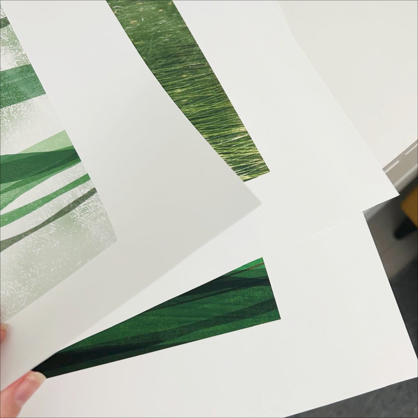Multiple Soft Ground art prints fanned out showing premium matte paper quality, OAM Studio